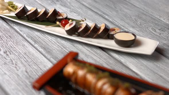 White Plate with Sushi Rolls.