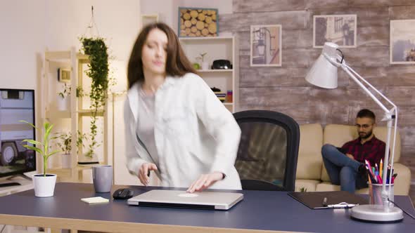 Girl Typing on Laptop While Working From Home