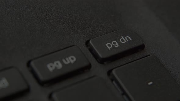 The Finger Presses the Enter Button on the Keyboard