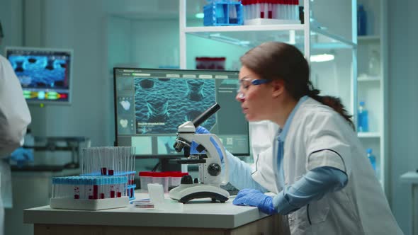 Microbiologist Working Late at Night for New Vaccine