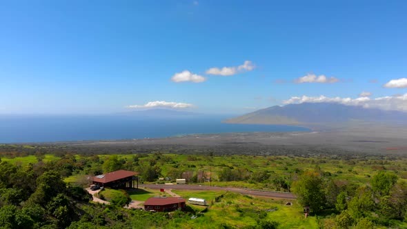 Beautiful 4k drone Maui upcountry near Keokea looking towards Maalaea Bay. February sky.