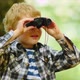 Boy Looking Through Binoculars In Woods - VideoHive Item for Sale