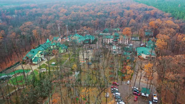 Residential complex between forests. Aerial view of luxury complex area surrounded by trees