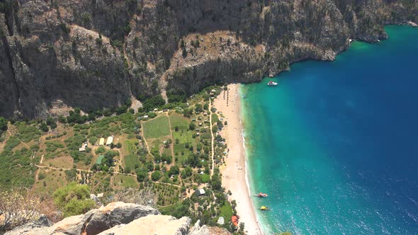 Deep Rocky Narrow Valley by the Turquoise Sea