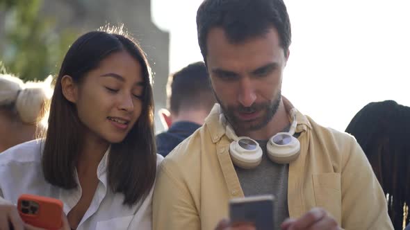 Multiethnic Students Using Smartphones Outdoor