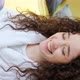 Curly Haired Girl Looking at Camera with Charming Smile Laughing - VideoHive Item for Sale