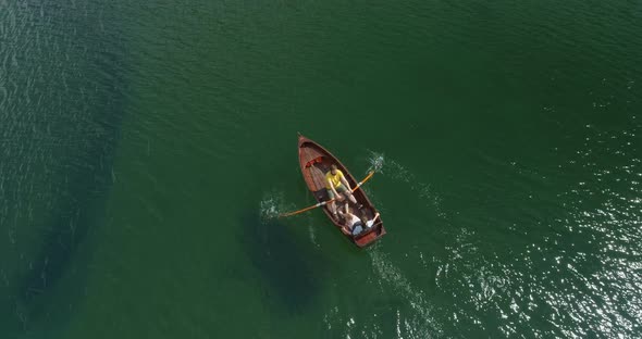 Young Couple In A Boat On The Background Of A Lake