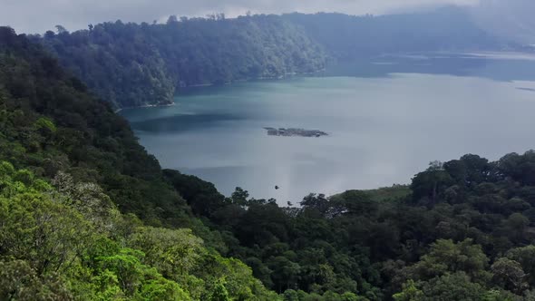 Aerial Landscape Green Mountain And Tropical Trees On Lake Shore. Bali, Indonesia.