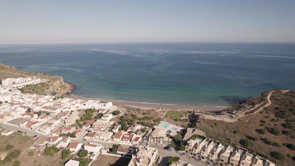 Aerial Atlantic ocean view from a small fishing village of Praia do Burgau, Budens Algarve Portugal.