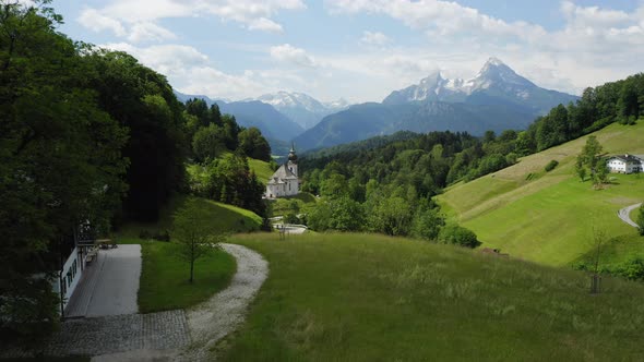 Aerial Fly Towards Church Maria Gern From Distance Mount Watzmann in Background Berchtesgaden