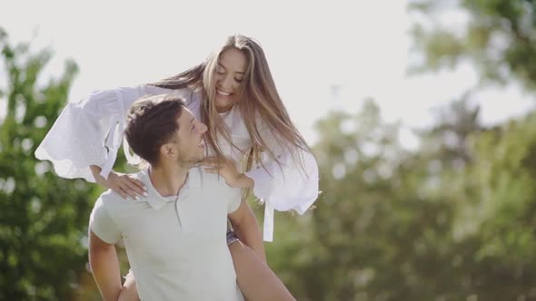 Beautiful Couple Having Fun In Nature. Portrait Of Handsome Man Smiling Woman.