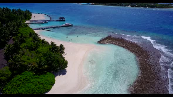 Aerial flying over scenery of luxury island beach journey by turquoise ocean and white sandy backgro