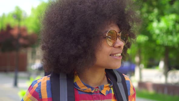 Portrait African Woman Tourist with an Afro Hairstyle