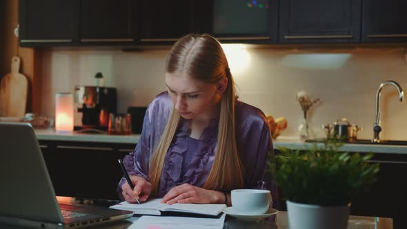 Young Business Woman Working at Home By Sitting at the Computer