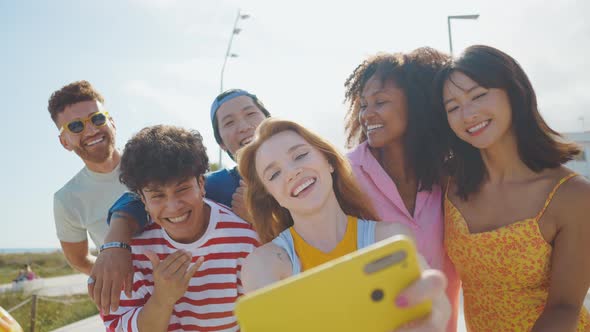 Group of friends having fun on the beach.