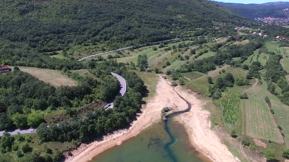 Aerial view of highway through green forested hills, Croatia