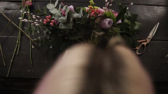 A Beautiful Bouquet of Flowers Decorated By a Florist Lies on a Table