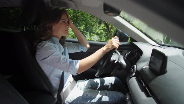 Pretty Woman Driving Modern Car Along Country Road