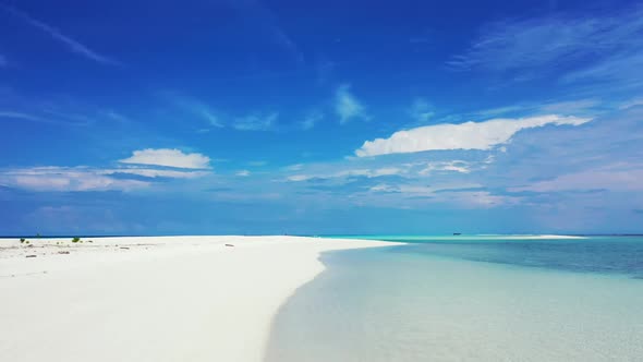 Aerial landscape of tranquil seashore beach voyage by shallow sea with bright sand background of a d