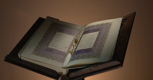 Holy Quran On Book Rest With Prayer Beads 3