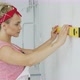 Woman Using Spirit Level on Wall - VideoHive Item for Sale