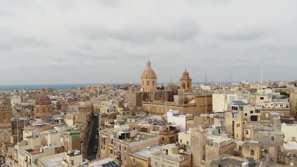 Domes of Basilica Of Senglea, in the Fortified Three Cities of Malta - Aerial slow Orbit shot