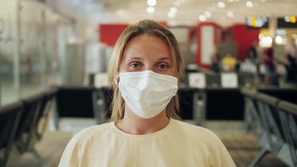 Portrait of Passenger Wearing Medical Protective Face Mask at Airport