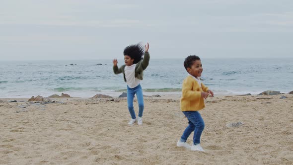 Small Children Have Fun On Beach