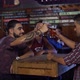 Guys doing chin-chin then drinking beer in a bar in Patagonia Argentina - VideoHive Item for Sale