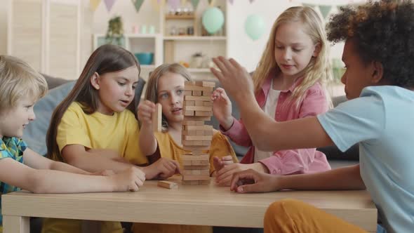 School Friends Playing with Wooden Blocks