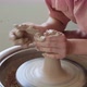 Female Potter Sitting and Makes a Cup on the Pottery Wheel. Woman Making Ceramic Item. Pottery - VideoHive Item for Sale