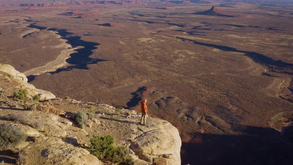 Aerial shot of a hiker at the the edge of Cedar Mesa in Utah