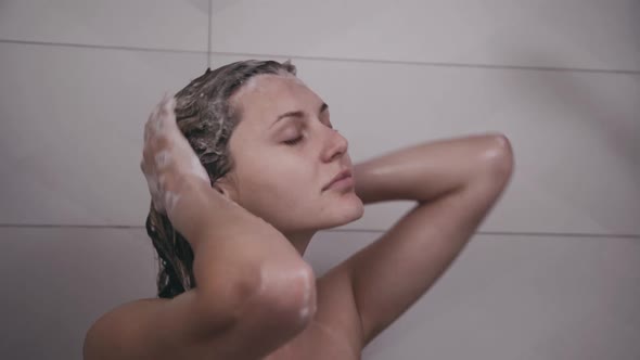 Happy Woman Taking a Shower with Smile on Face