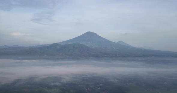 rural view and Mount Sumbing, central java, Indonesia. foggy weather in morning with a view of the m