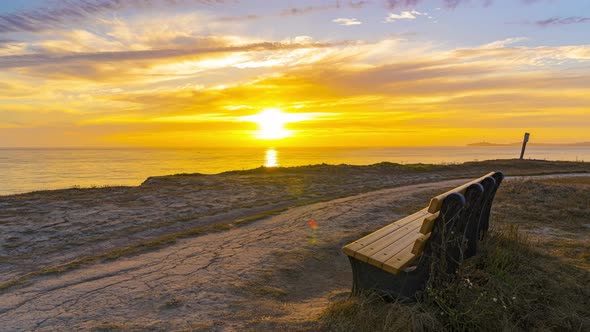 Time Lapse: Half Moon Bay California sunset at the beach and a bench