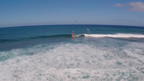 Aerial view of a man windsurfing in Hawaii