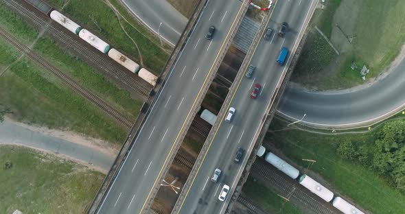 Highway Near Railway, Freight Train Ride on Railroad, Car Traffic on Road Junction, View From Height