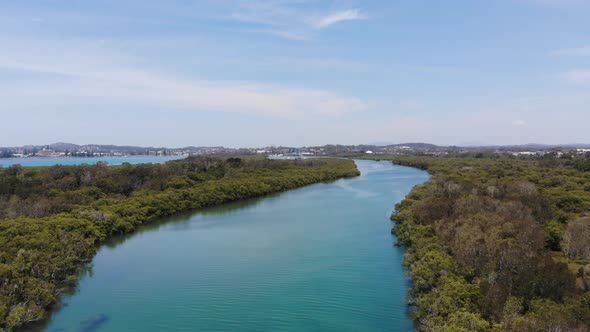 Flying over The Hastings River Canal at Woregore Nature Reserve Australia during a Beautiful Summer