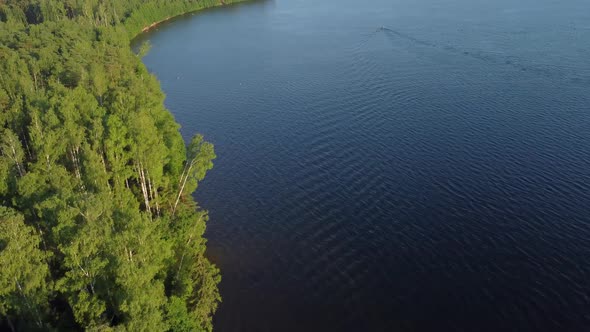 Aerial View Of Summer River Landscape And Small Village In Sunny Summer Evening