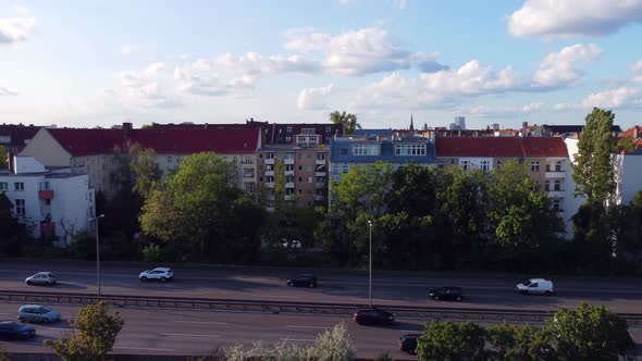 On the side of the S-Bahn tracks, hwy next to a tree.Calmer aerial view flight lift off aerial dron