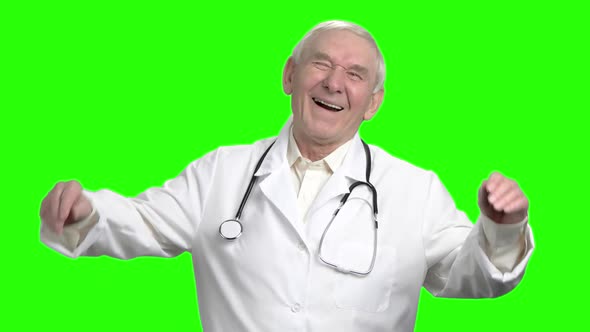 Senior Doctor Laughing at Your Joke, Slow-motion.