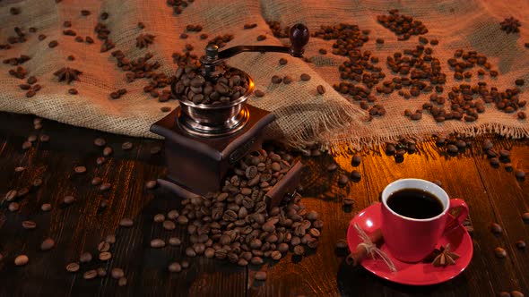 Red Cup with Black Coffee on the Wooden Table. Studio