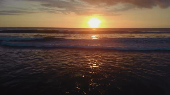 Flight at Sunset Overlooking the Indian Ocean in Bali Indonesia