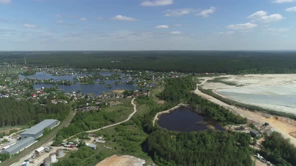 Aerial view of The village around the lake and Huge sand dumps 06