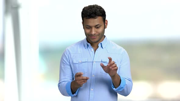 Young Man Using Glass Digital Tablet.