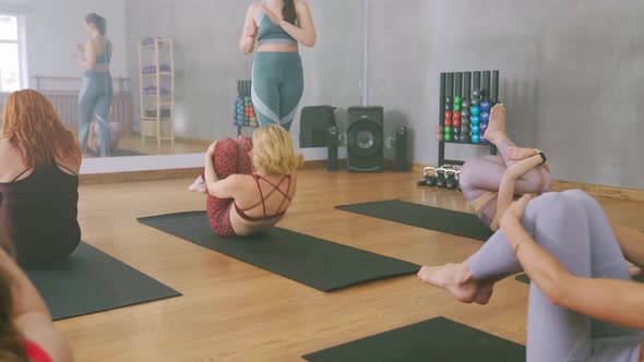 A Group of Women Doing Pilates in the Light Studio