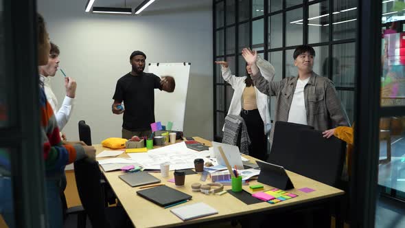 Joyful Coworkers High Five Celebrating Success