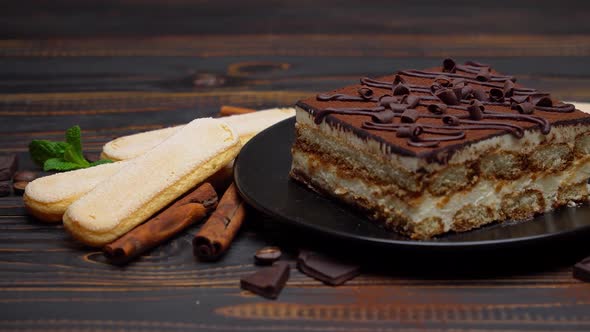 Portion of Traditional Italian Tiramisu Dessert Coffee Beans and Savoiardi Cookies