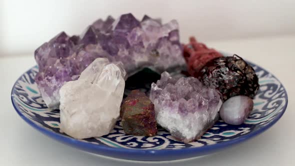 Holistic round plate filled with various crystals (Purple Amethyst, White Quartz, Bornite/Chalcopyri