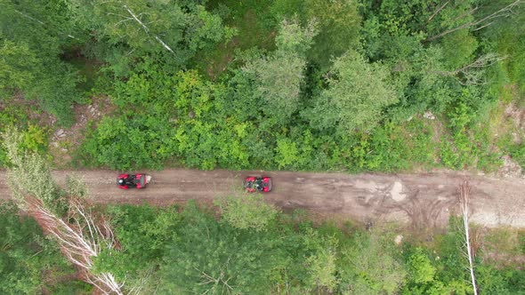 Sequence of People Driving ATVs in Rough Terrain